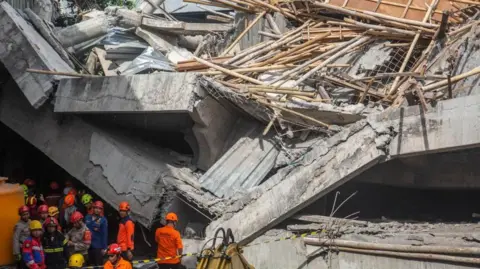 Tragic School Collapse in Indonesia Claims Lives and Traps Many
