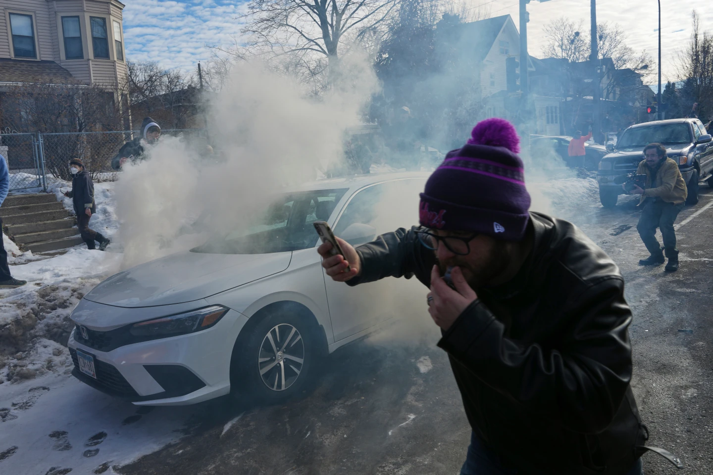 Tensions High in Minneapolis as Federal Agents Use Tear Gas on Bystanders Following Car Crash Incident