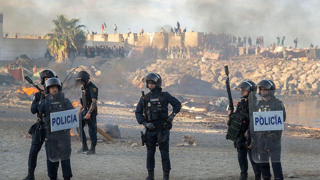 Violence erupts in Ceuta amid migrant influx, locals protest